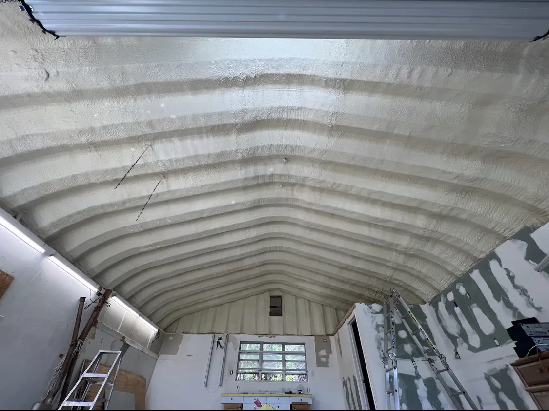 Spray polyurethane foam applied to the underside of a metal roof deck in Miami Lakes